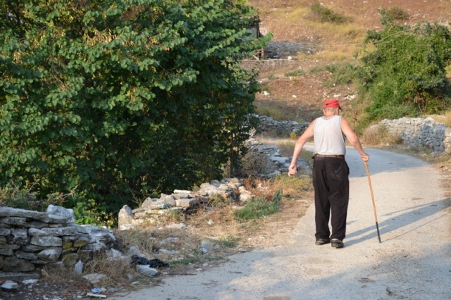 An old Albanian man with a walking stick