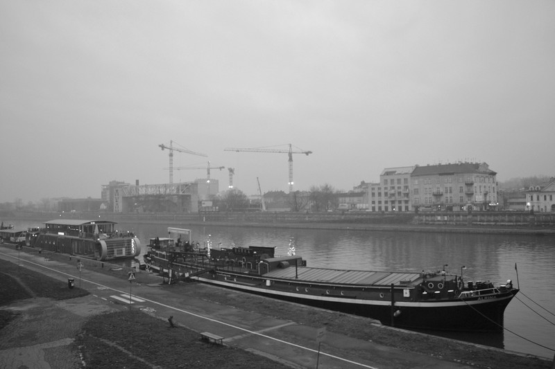 Boats on the Vistula river with the old ghetto in the distance, Krakow